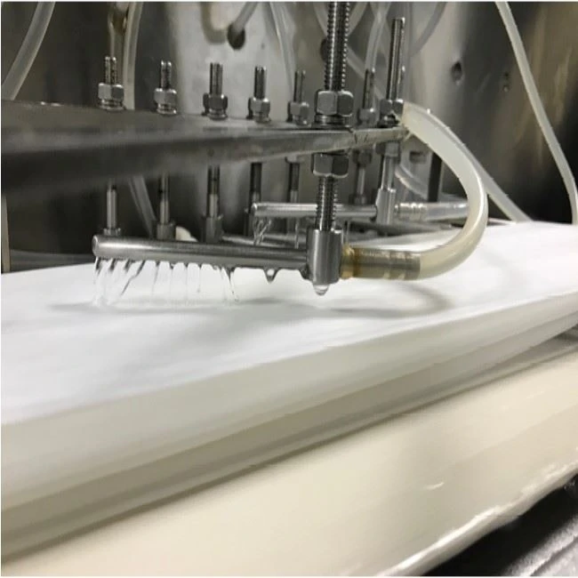 Wetting device for wet wipes production
